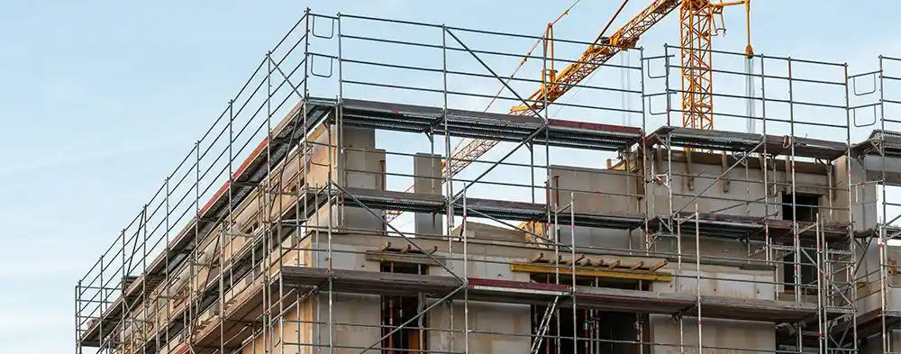 Scaffolded building site showing support for conversions and development through commercial finance