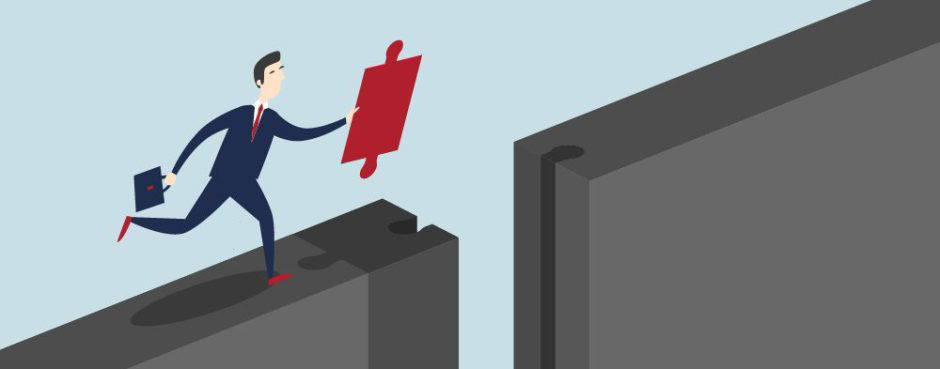 Businessman bridging gap with puzzle piece symbolising problem solving